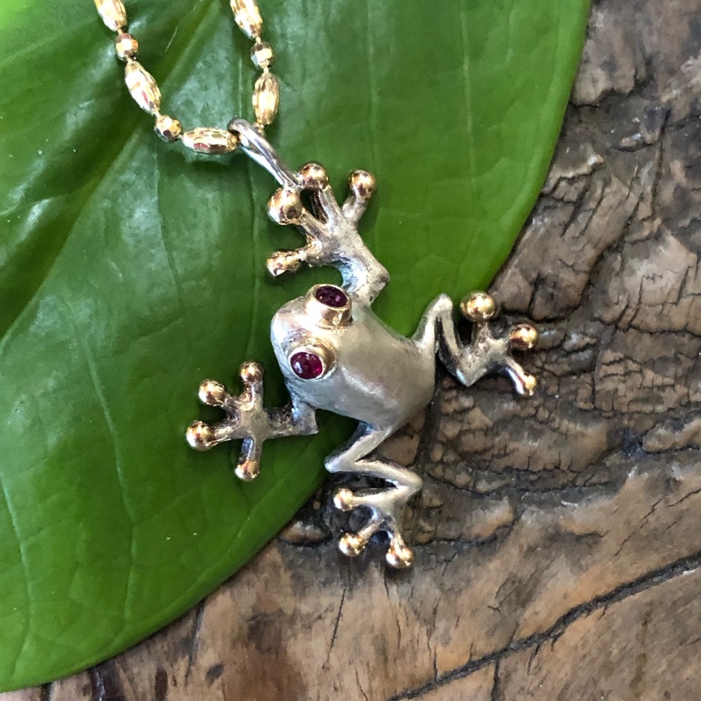 14kt gold & sterling silver w/ ruby eyes pendant.